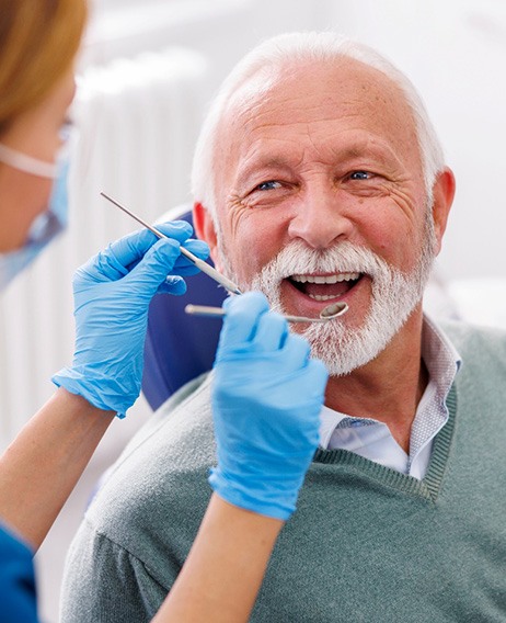 Mature man smiling during dental checkup