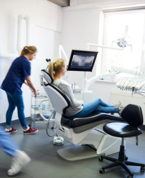 Woman sitting in dental treatment chair