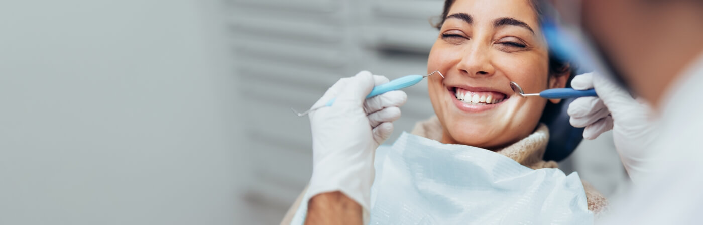 Woman grinning during dental checkup