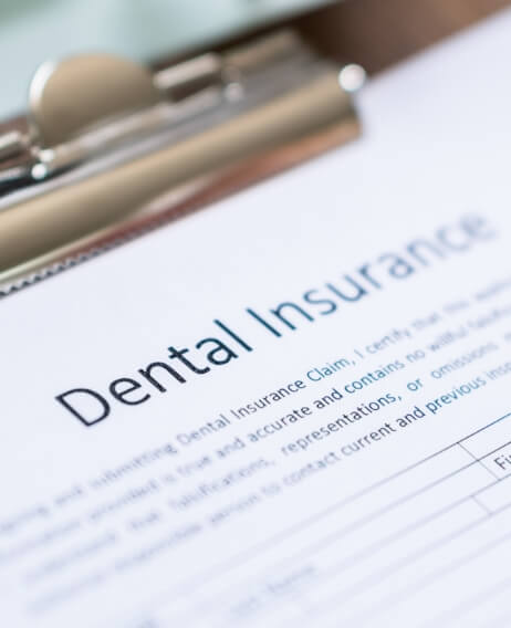 Dental insurance form on a clipboard