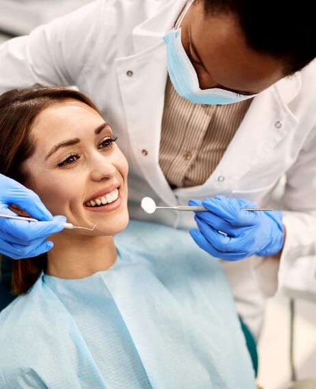 Dental patient having her teeth examined