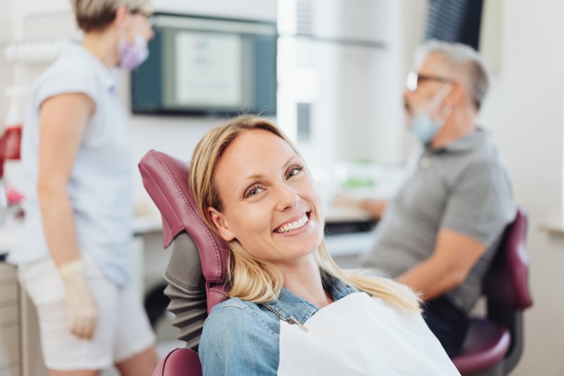 Woman smiling in the dental chair